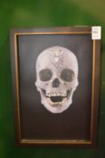 In the manner of Damien Hirst, a photographic print on canvas of a diamond skull.