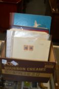 A box of various stamp albums and loose leaves of stamps (quantity).