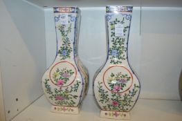 A pair of Chinese Famille Rose square shaped baluster vases.