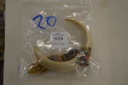 A bone pendant and necklace.