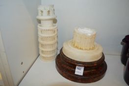 A carved alabaster temple on a turned base (AF).