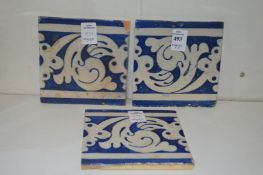Three Islamic blue and white tiles.