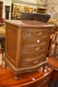 A mahogany three drawer bedside chest.