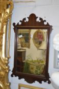 A Georgian style mahogany framed fretwork wall mirror.