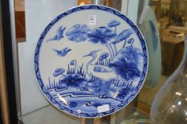 A Chinese blue and white dish painted with a bird.