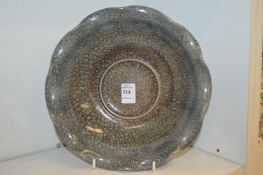 A large Chinese crackle glazed bowl with wavy rim.