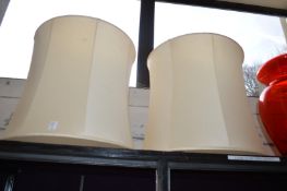 Two large lampshades.
