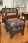 A small eastern chair with Mashrabiya work panels.