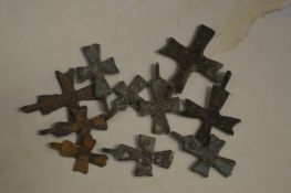 A group of small Roman bronze crosses.