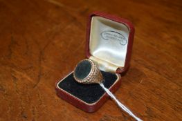 A 9ct gold and blood stone gentlemen's signet ring.