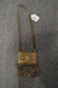 An eastern white metal rectangular large pendant and chain.