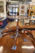 A good George III design mahogany pie crust tilt top tripod table on well carved base with paw