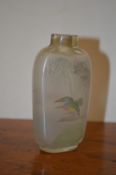 A Chinese reverse painted glass snuff bottle.