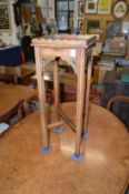 A Chippendale style mahogany urn stand.