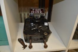 An old taxi for hire machine.