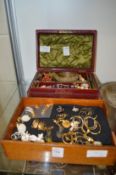 A leather jewellery box and contents together with a quantity of earrings.