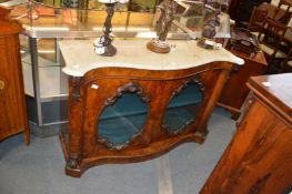 A Victorian walnut serpentine fronted side cabinet with marble top, a pair of mirrored doors on a