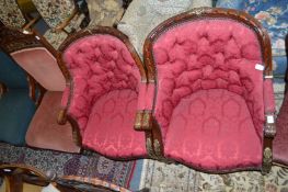 A good pair of carved mahogany and parcel gilt framed button upholstered armchairs.