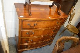 A good Georgian style yew wood bow front four drawer chest with inlaid decoration.