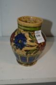 A small Islamic style glazed pottery vase.