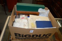A large box of assorted loose and albums of stamps.