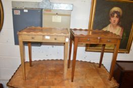A pair of mahogany two drawer lamp tables.