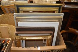 A quantity of picture frames.