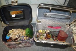 Two boxes containing a large quantity of costume jewellery.