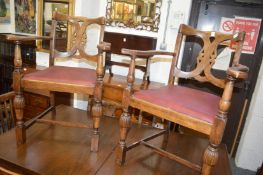 A set of six oak 1930's dining chairs, two with arms.