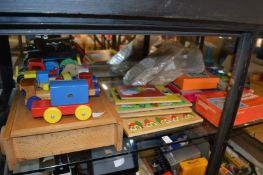 A quantity of old wooden and other toys.