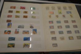 A large album containing numerous Australian stamps.