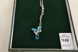 A decorative pendant and chain.