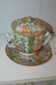 A Chinese Canton twin handled ecuelle, cover and stand.
