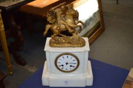 A Victorian white marble mantle clock with spelter mount, modelled as a knight on horseback.