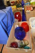 Colourful glass vases and other ornamental items.