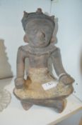An unusual pottery seated figure.