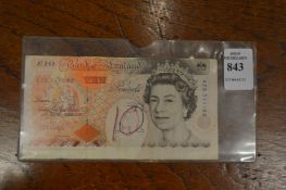 A misprinted £10 note.