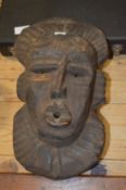 An African carved wood mask.