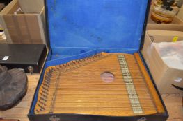 A cased zither.