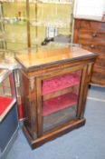 A Victorian inlaid walnut pier cabinet with ormolu mounts.