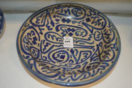 An Islamic circular pottery bowl.