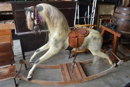 A large fibreglass rocking horse.