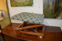 An adjustable stool and a sewing box.