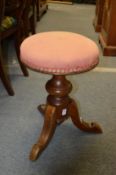 A Victorian mahogany revolving music seat.