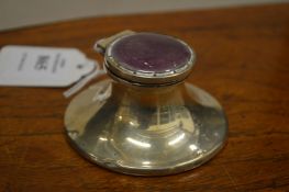 A small silver and enamel capstan inkwell.