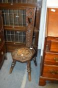 A carved walnut spinning chair and another chair.