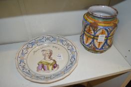 A tin glazed plate depicting Marie Antoinette together an Italian drug jar.