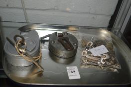 Two padlocks with various keys.
