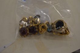 Six pairs of decorative ear clips.