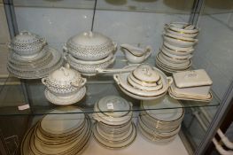 Two part dinner services with gilt decoration.